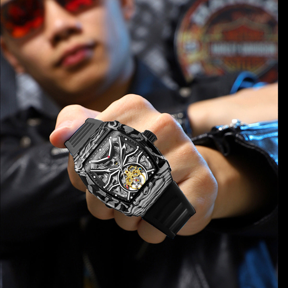 man wearing MUSANFIGO MF02 tonneau skeleton watch on wrist - casual streetwear style with denim jacket